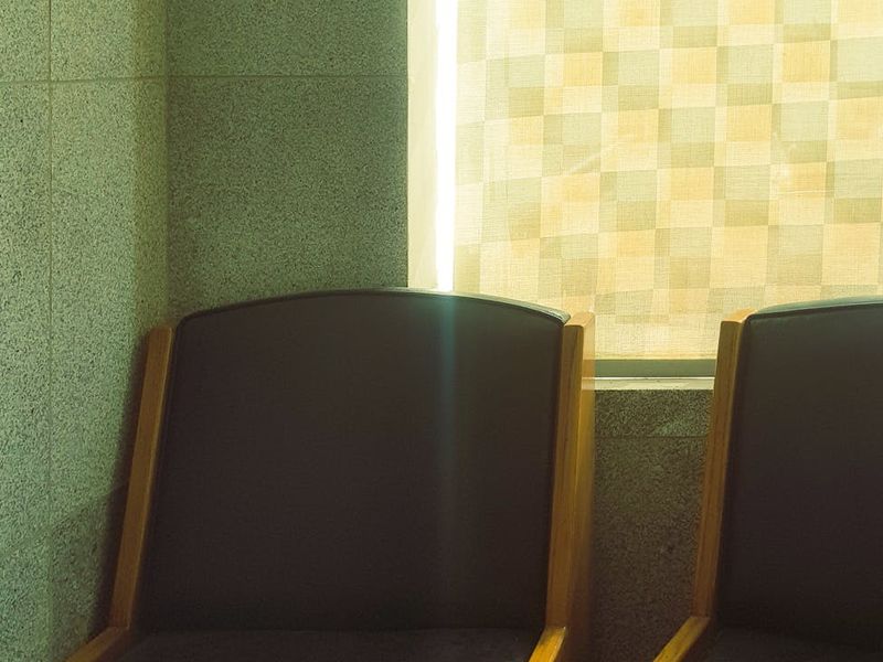 Spacious, clean workout area with natural light coming from a large window.